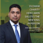 Oldham charity hero Amin salutes the new King in person